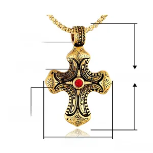 Polished gold stainless steel cross necklace with red stone and detailed carving