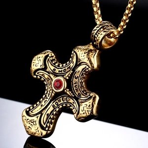 Ornate gold titanium steel cross pendant with red gemstone and vintage engraving