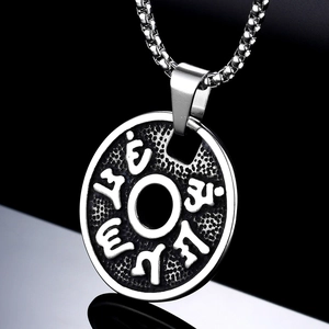 Vintage stainless steel Mantra pendant necklace with silver finish on reflective black background