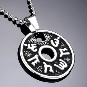Retro stainless steel mantra cylinder pendant with silver bead chain on black surface