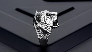 Macro shot of punk style tiger head ring with detailed vintage black metallic texture