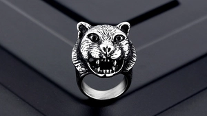Macro shot of punk style tiger head ring featuring detailed metal fur texture