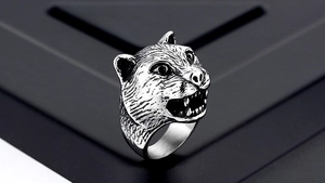 Detailed macro view of vintage tiger head ring showing intricate metal fur texture