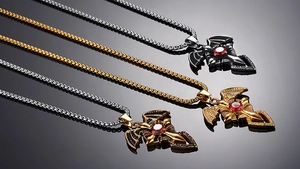 Gothic bat cross necklaces with vibrant red central gemstones and elegant box chains