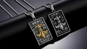 Close-up of retro punk shield pendants with fleur-de-lis emblem and woven texture