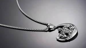 Detailed view of silver stainless steel dumbbell necklace with muscular bodybuilder pendant