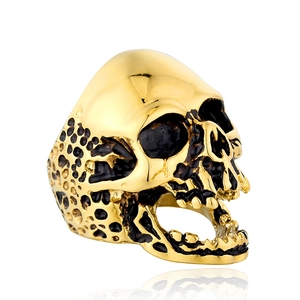 Men's punk skull ring in gold stainless steel with black enamel finish and teeth detail