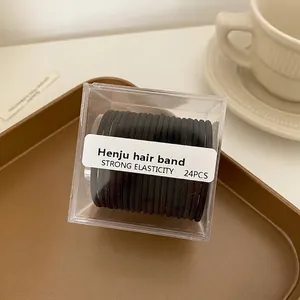 Détail de 24 élastiques à cheveux noirs haute élasticité dans une boîte transparente