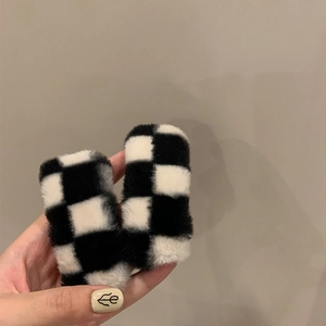 Set of two plush black and white checkerboard hair clips with a trendy minimalist design