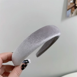 Detail of silver-grey velvet sponge headband showing thick fabric texture and shimmer