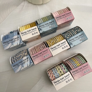 Detail of candy-colored elastic hair ties showing woven texture and various color palettes