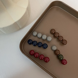 Set of five elegant Korean-style hair clips with colorful spherical resin beads in a tray