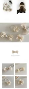 Detailed view of apricot bow hair clips with faux pearls and sparkling rhinestone accents