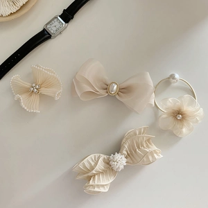 Set of beige bow hair clips and floral scrunchie with elegant faux pearl details