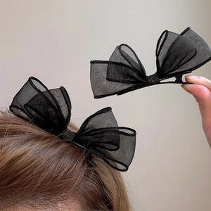 Paire élégante de barrettes nœuds en maille noire avec paillettes et pince crocodile