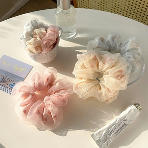 Elegant floral mesh scrunchies in pastel colors for messy bun and ponytail styling