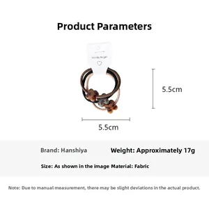 Detail view of leopard print flower hair ties set showing 5.5cm diameter size and three colors