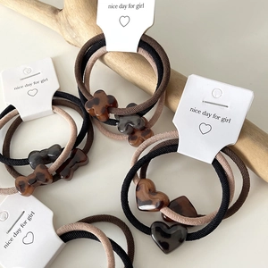 Chic leopard print hair scrunchies set with acrylic heart and bow charms for women