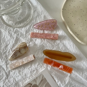 Set of 6 minimalist hair clips in pink marble and amber acetate for women's hair styling