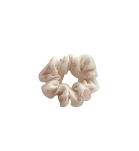 Elegant floral print mesh scrunchie with pink flower patterns on cream chiffon fabric