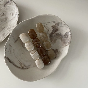 Three-piece elegant amber and marble texture acrylic hair clips for women in a set