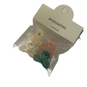 Set of 4 cute jelly color flower mini hair clips in pastel yellow, pink, white, and green