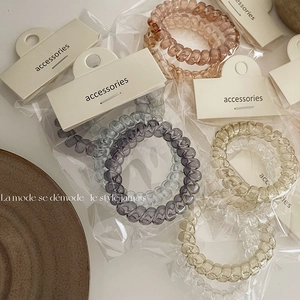 Elastici per capelli a spirale in colori Morandi in confezioni premium eleganti