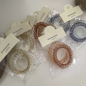 Set di elastici a spirale per capelli stile cavo telefonico in colori neutri con etichetta