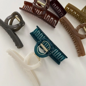 Polished hair claw clips in various colors with strong gold metal springs for women