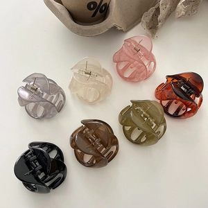 Set of seven Korean style jelly color matte resin claw clips on a minimalist white background
