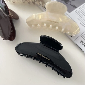 Minimalist marble pattern acetate hair claws in black, cream, and leopard print colors