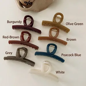 Set of 7 matte geometric hair claw clips in assorted elegant colors for women