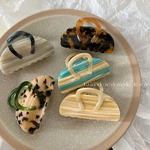 Set of five elegant leopard print acetate hair claws in various stylish marbled colors