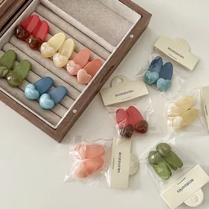 Lot de 2 jolies barrettes en forme de cœur aux couleurs gelée pastel en résine mate