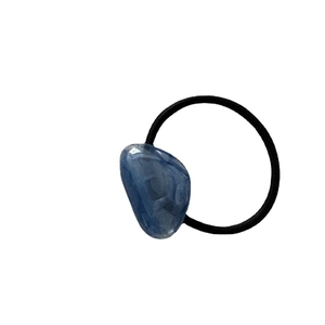 Minimalist elastic hair tie featuring a polished dark blue irregular acrylic pea bead accent