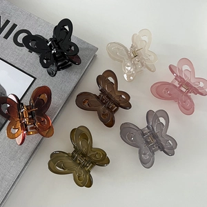 Matte jelly butterfly hair claws in seven colors including amber, olive, and pink acrylic
