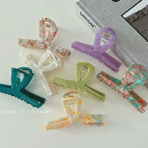 Set of 7 elegant acetate hair claw clips with various colorful marble patterns