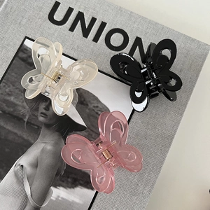 Three-piece set of butterfly acrylic hair claws in cream, black, and soft pink colors