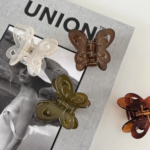 Close-up of double-layered butterfly hair claws in matte frosted jelly colors and resin
