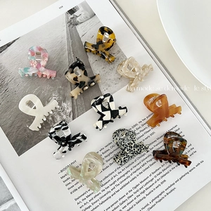 10-piece set of acetate hair claws in leopard, marble, and checkerboard patterns