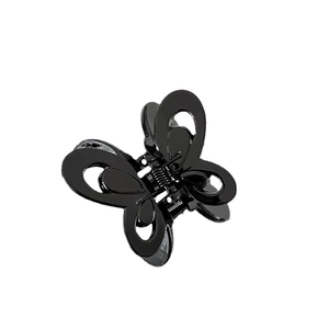 Glossy black butterfly hair claw clip with cutout design and metal spring for women
