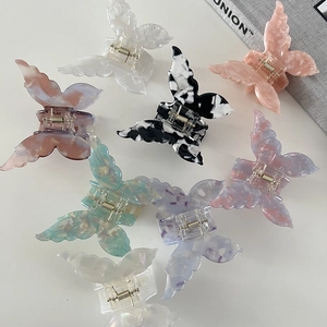 Elegant butterfly acetate hair claws in iridescent colors with high-quality metal spring