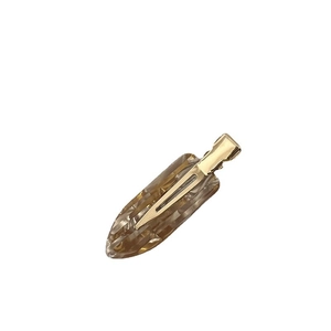 Elegant amber acetate leaf hair clip with golden metal crocodile grip for women
