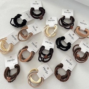 Neutral tones hair ties set with multiple textures and high elasticity on display cards