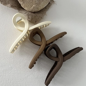 Matte Morandi large hair claw clips in beige and brown colors with a minimalist design