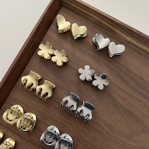 Chic mini metal hair claws in gold and silver with smiley and heart shapes