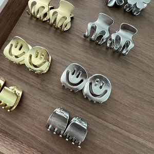 Mini metal alloy smiley face hair clips in matte gold and silver finish for women
