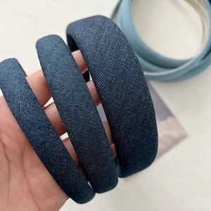 Detailed close-up of blue denim padded headbands showing texture and fabric grain