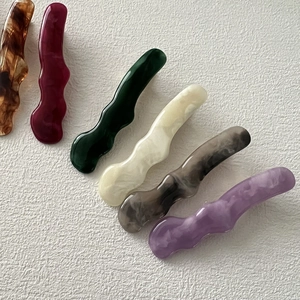 Minimalist wave hair clips in six colors including tortoiseshell and ivory white