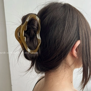 Irregular olive amber acetate hair claw clip for elegant French hair styling and updos